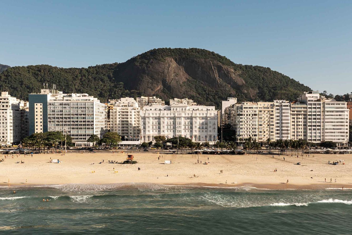The white palace facade of Copacabana Palace above Copacabana beach in Rio de Janeiro