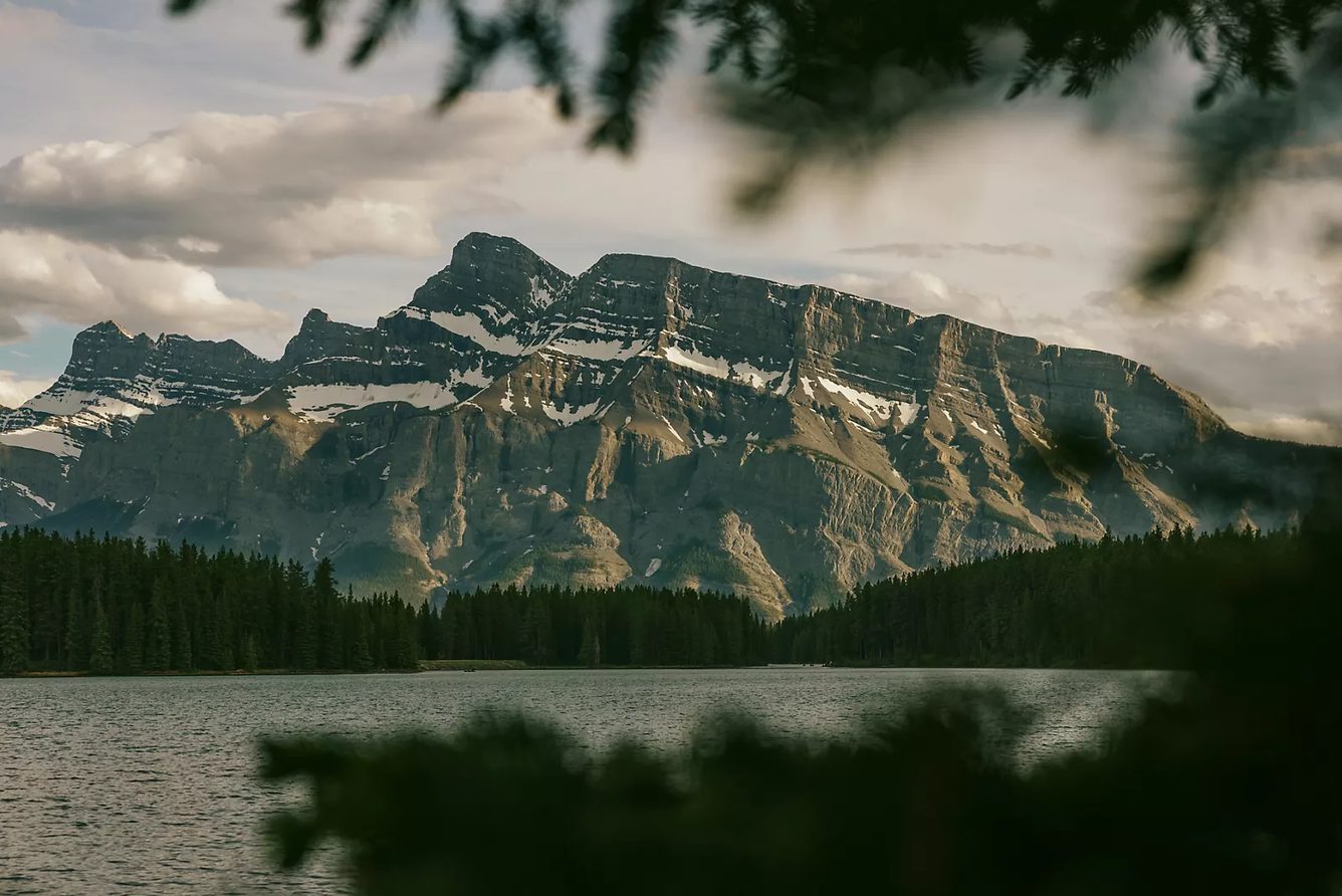 Mount Rundle above a lake in Banff National Park, the view across the Bow Valley from Fairmont Banff Springs