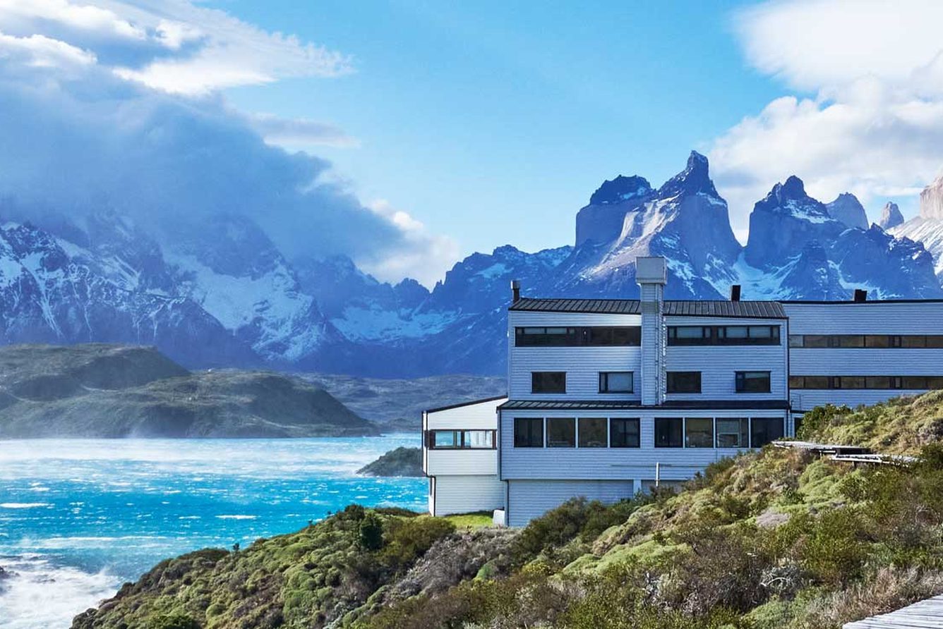 The Explora Torres del Paine lodge on the shore of Lake Pehoé, with the Paine massif behind it