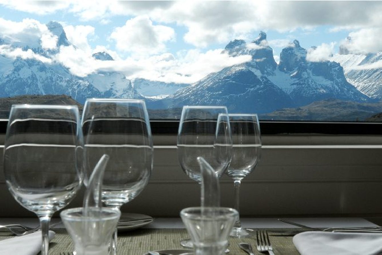 A set dining table at Explora Torres del Paine looking out over the Paine massif