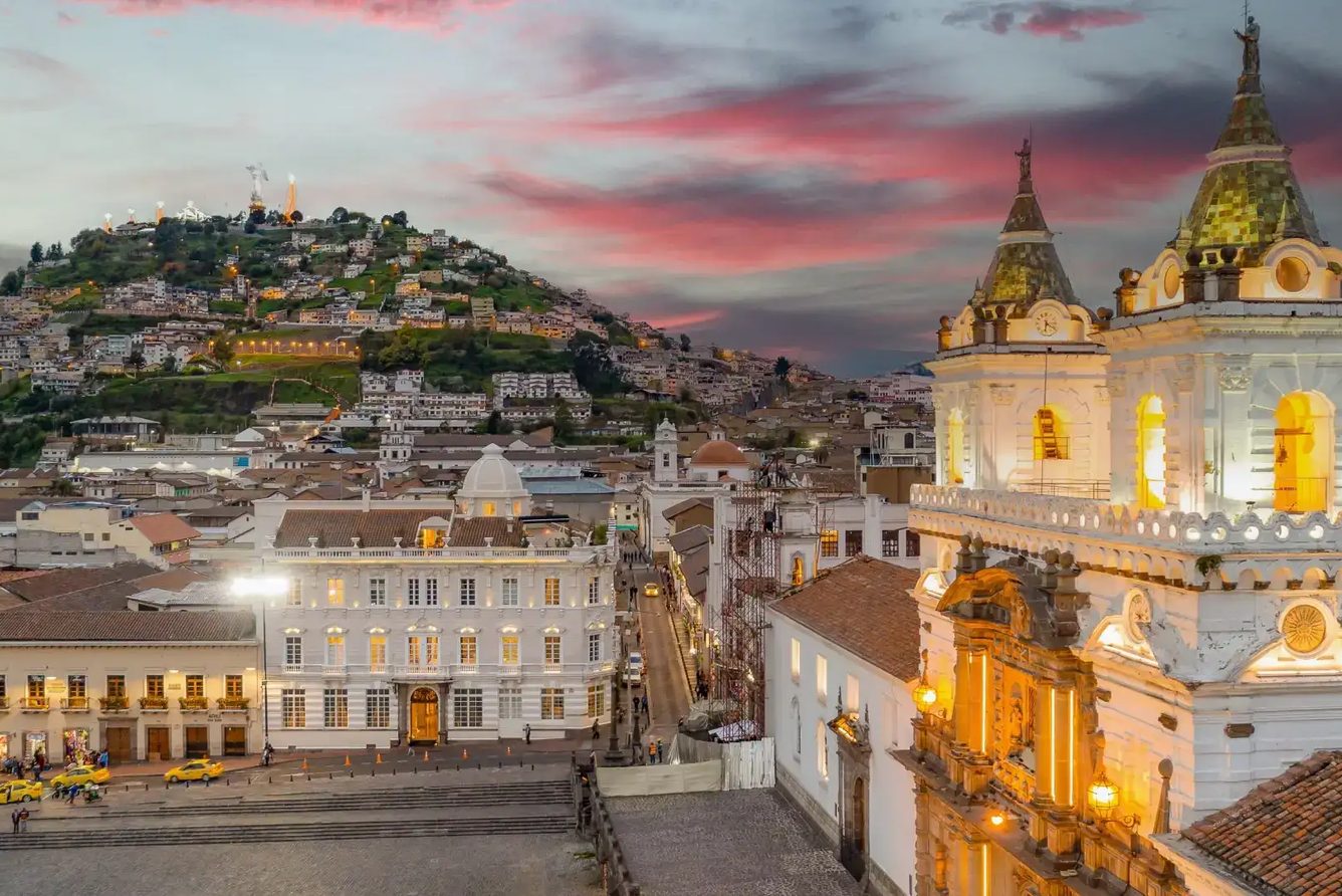 Plaza San Francisco and the church towers at dusk from Casa Gangotena, Quito