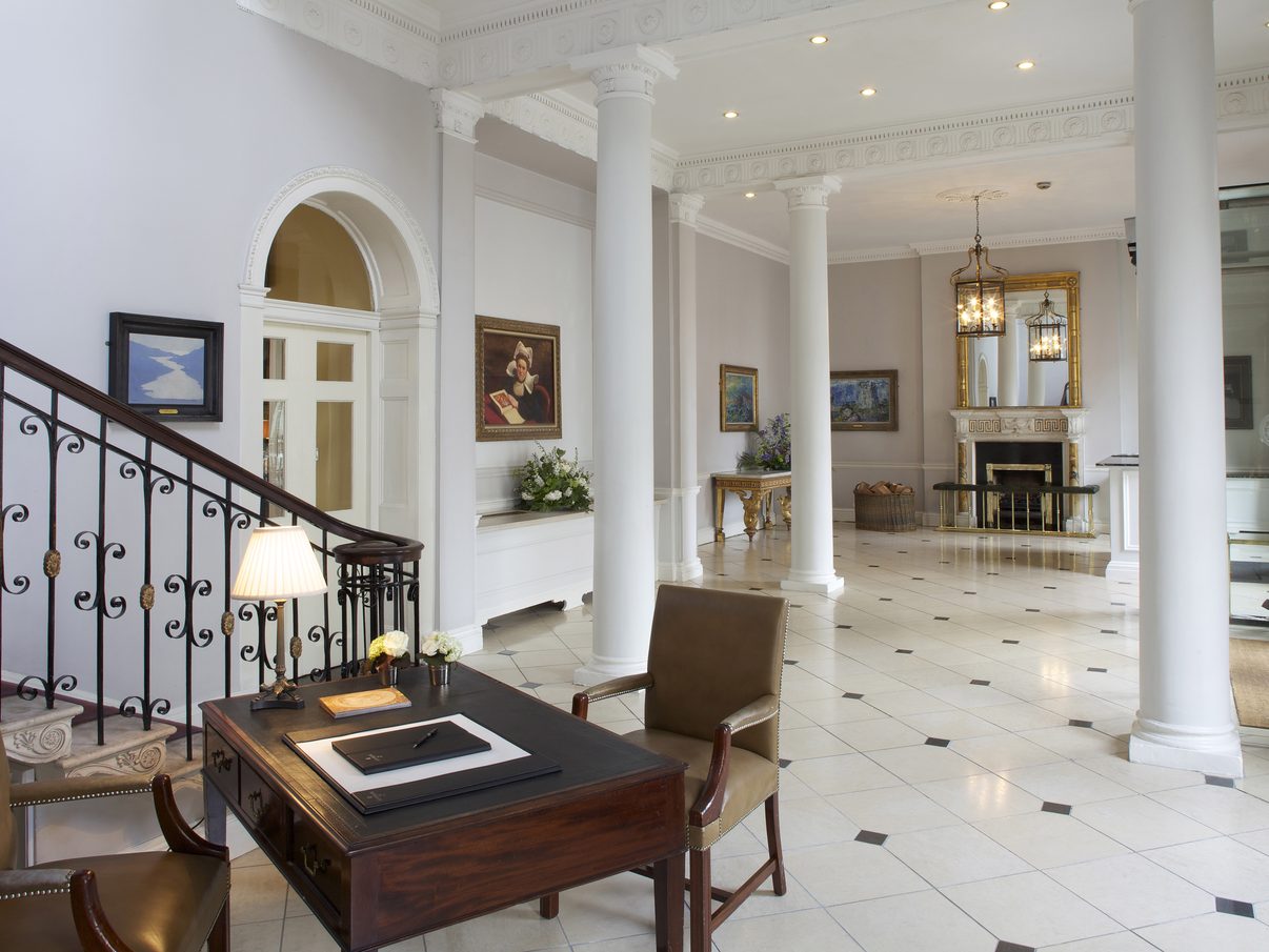 The Front Hall of The Merrion Hotel in Dublin, a columned lobby with a marble floor