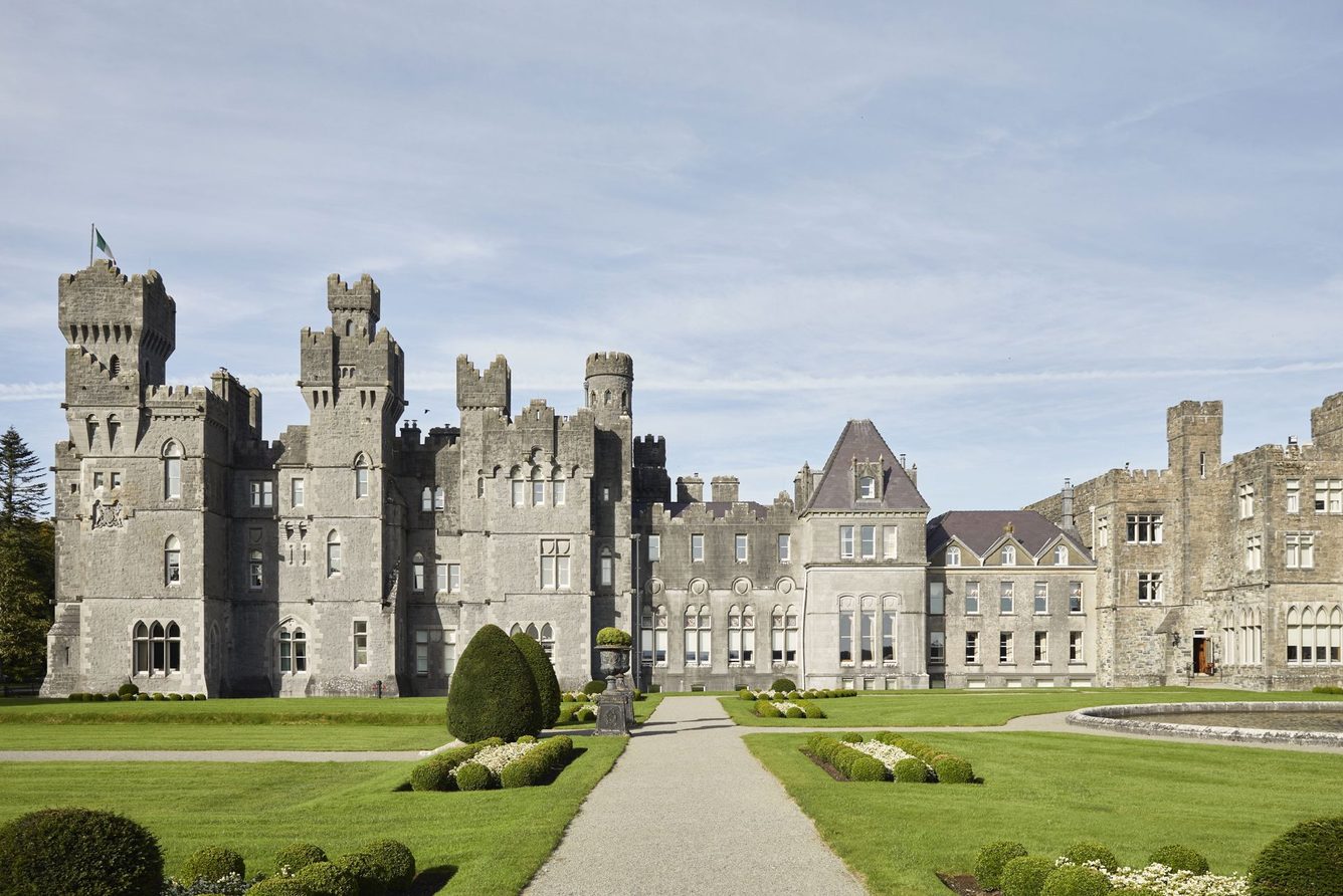 Ashford Castle seen from across its lawns and the shore of Lough Corrib at Cong, County Mayo