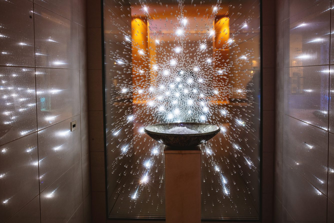 An illuminated water feature in the Britannia Spa at Britannia Hotel