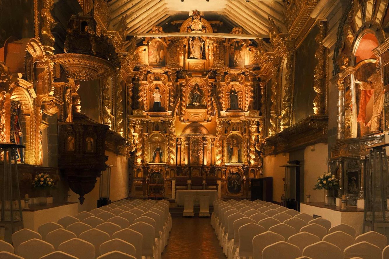 The hotel's gilded colonial chapel, hung with Cusco School paintings