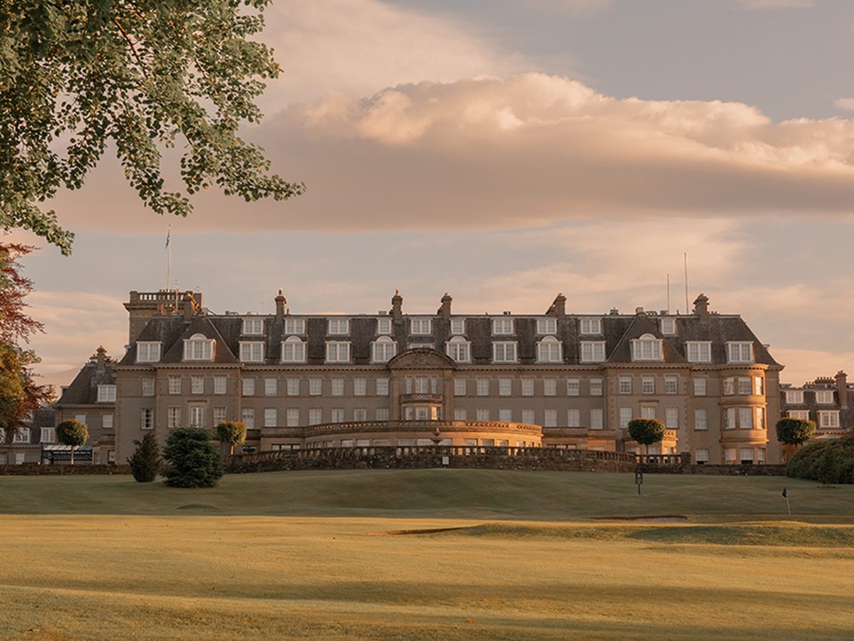 The Gleneagles hotel seen across its golf course at golden hour, Auchterarder, Perthshire