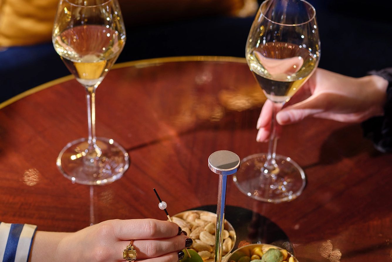 Champagne and canapés served at a table in the bar at Baur au Lac, Zurich