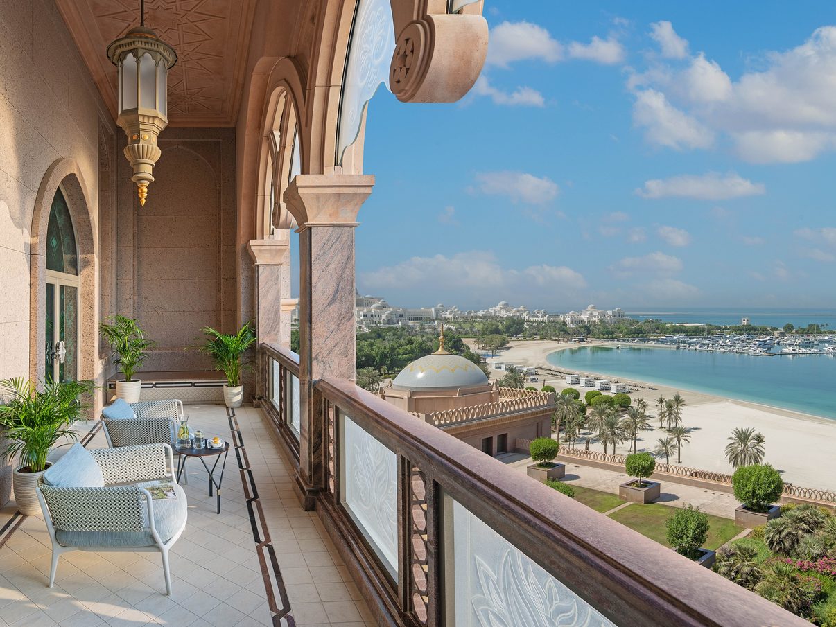 Sea-view balcony at Emirates Palace Mandarin Oriental looking along the Corniche beach towards the palace's central dome