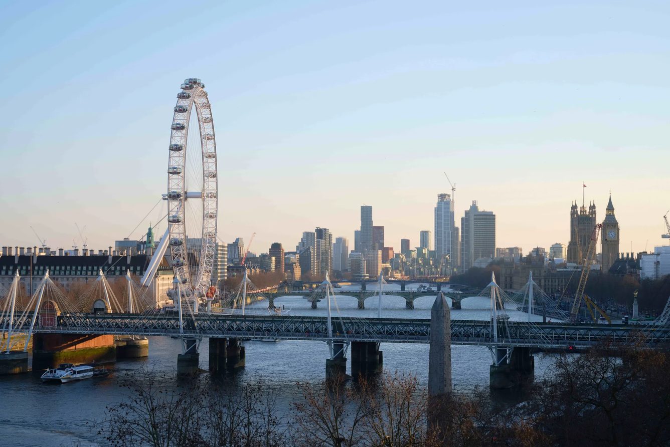 The River Thames at Hungerford Bridge with the London Eye and the South Bank skyline, seen from The Savoy